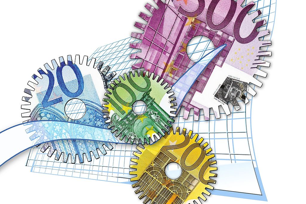 Symbolgrafik: Zahnräder aus Geldscheinen, die ineinander greifen, Link zur Seite "Neues Kommunales Finanzwesen"